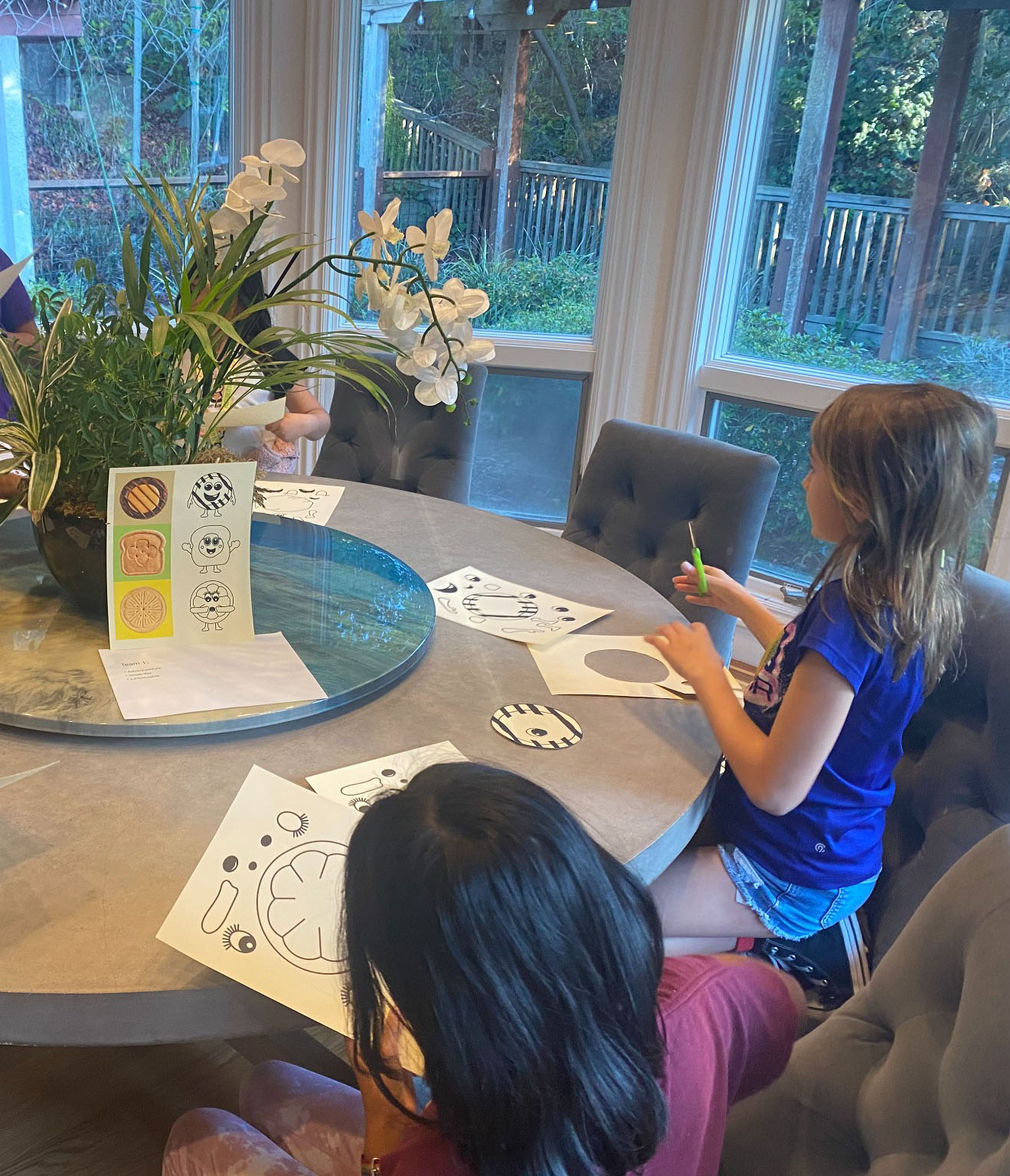 Girls creating cookie characters together
